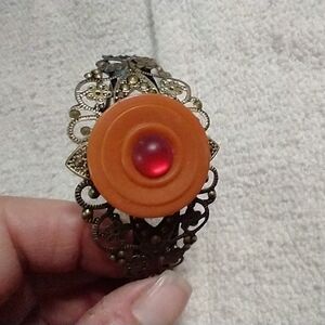 Goldtone filigree lacy red orange cuff bracelet